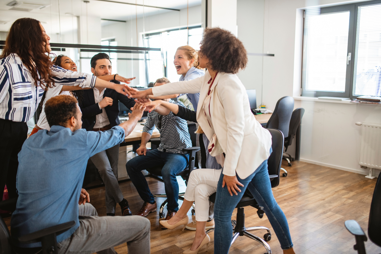 people all celebrating together in an office